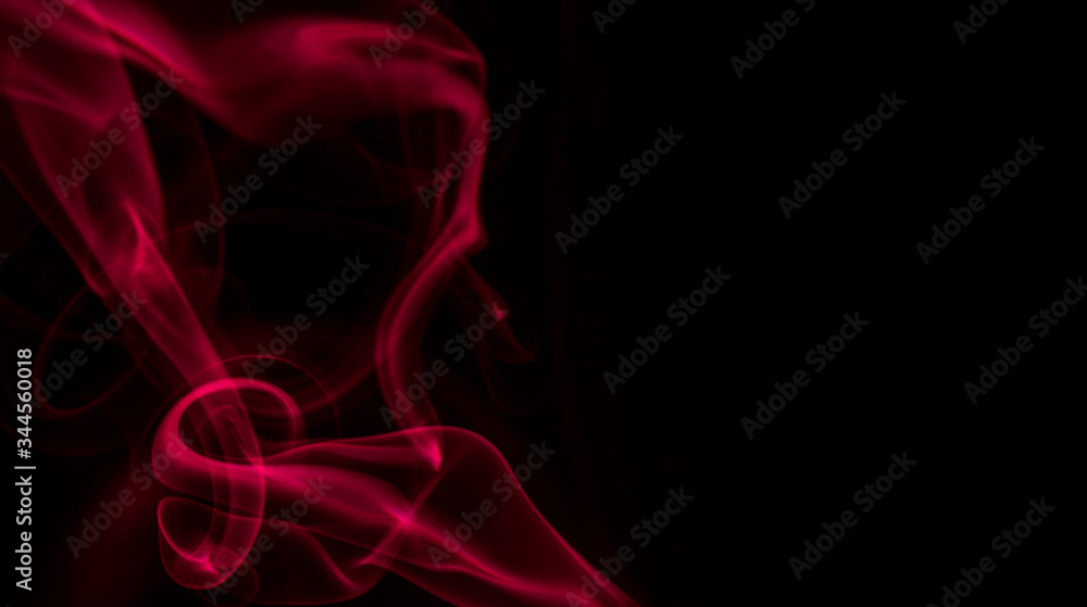 Fototapeta premium Red smoke on black background