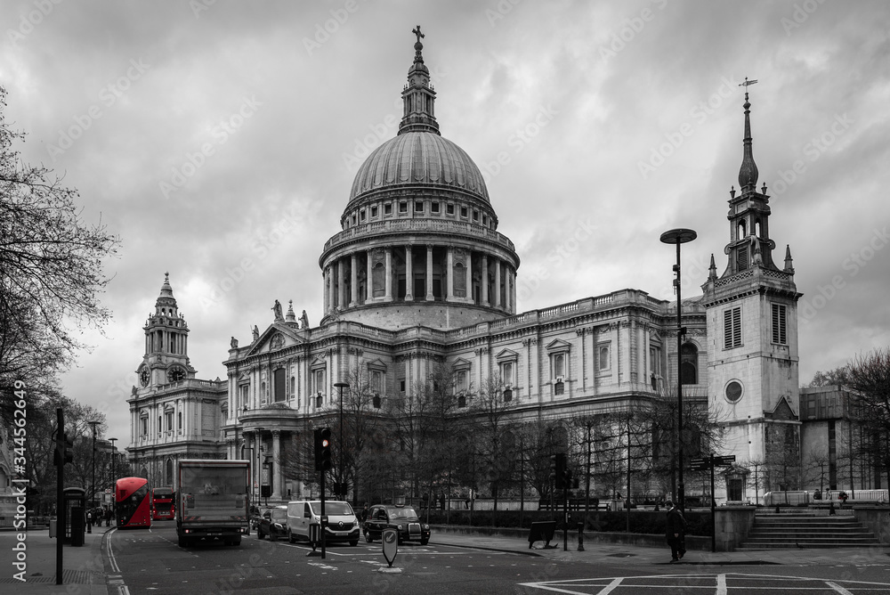 St. Paul's Cathedral in London in black and white with a red double-decker bus