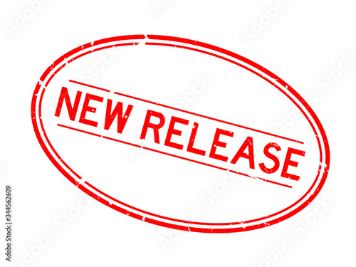 Grunge red new release word oval rubber seal stamp on white background