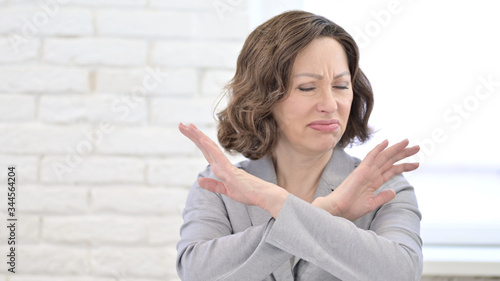 Denying Old Woman saying No with both Arms Gesture