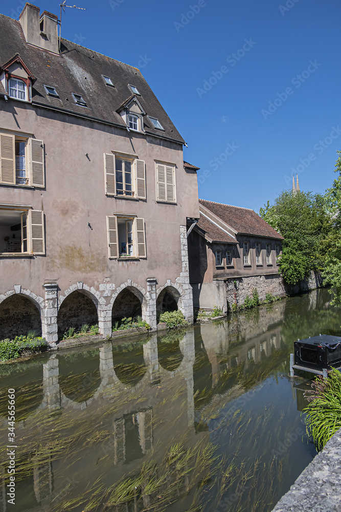 Scenic view of Eure River banks and houses in Historic Center of Chartres. Chartres, Eure-et-Loir department, Centre-Val de Loire region, France, Europe.