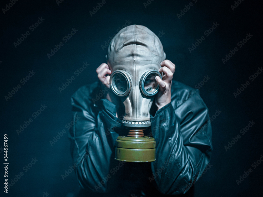 Men with a vintage mask gas and leather coat