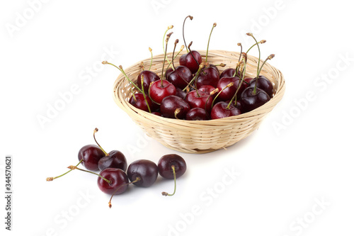 Cherries on wicked plate photo