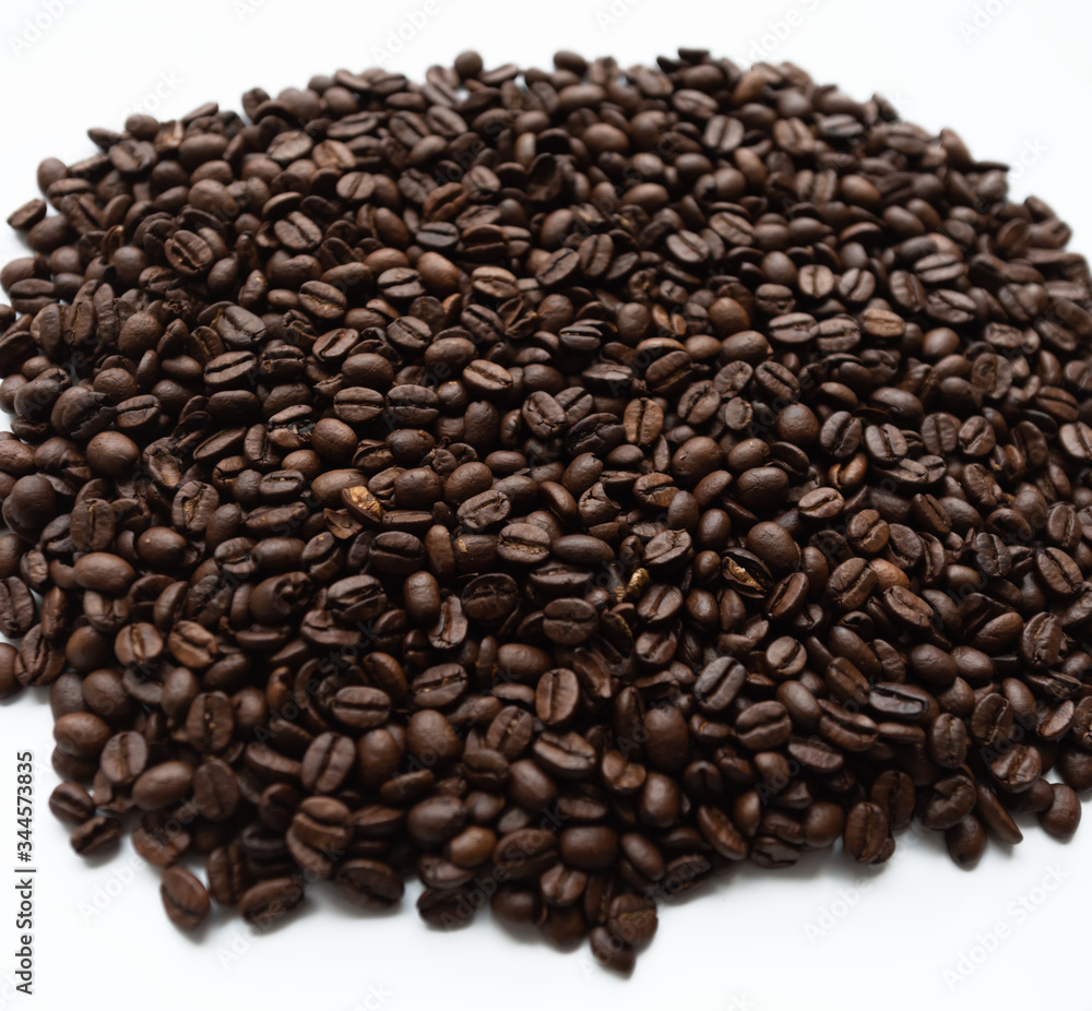 Coffee beans lying on white isolated background
