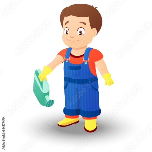 Smiling boy in a denim overall holds watering can