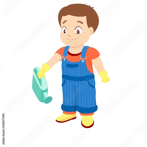 Smiling boy in a denim overall holds watering can