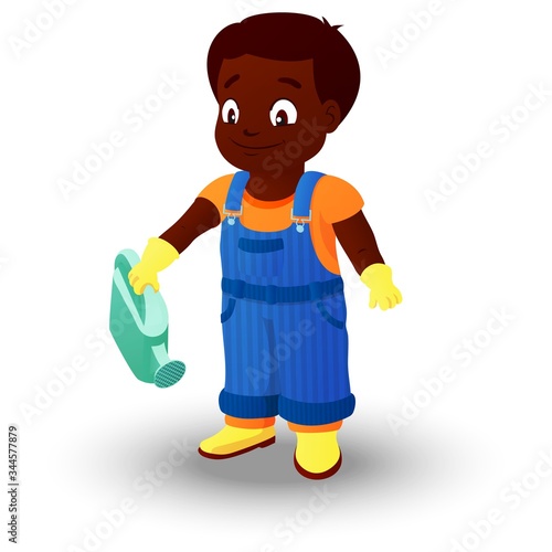 Smiling boy in a denim overall holds watering can