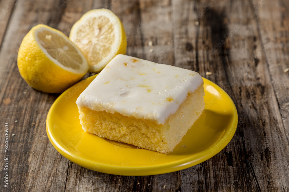 homemade lemon cake in squares on wood homemade lemon cake in squares on wood