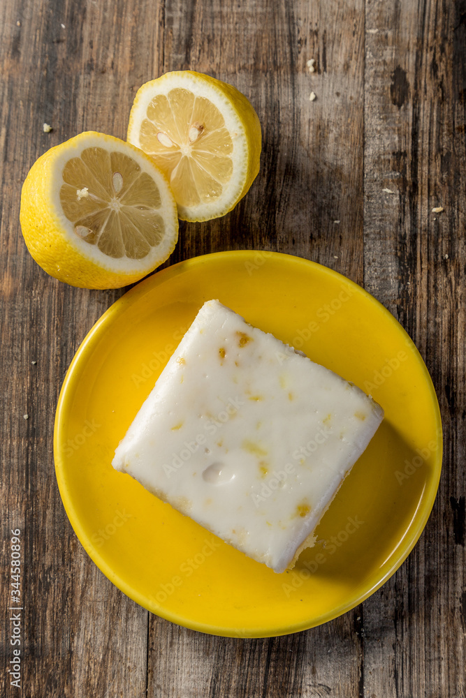 homemade lemon cake in squares on wood homemade lemon cake in squares on wood