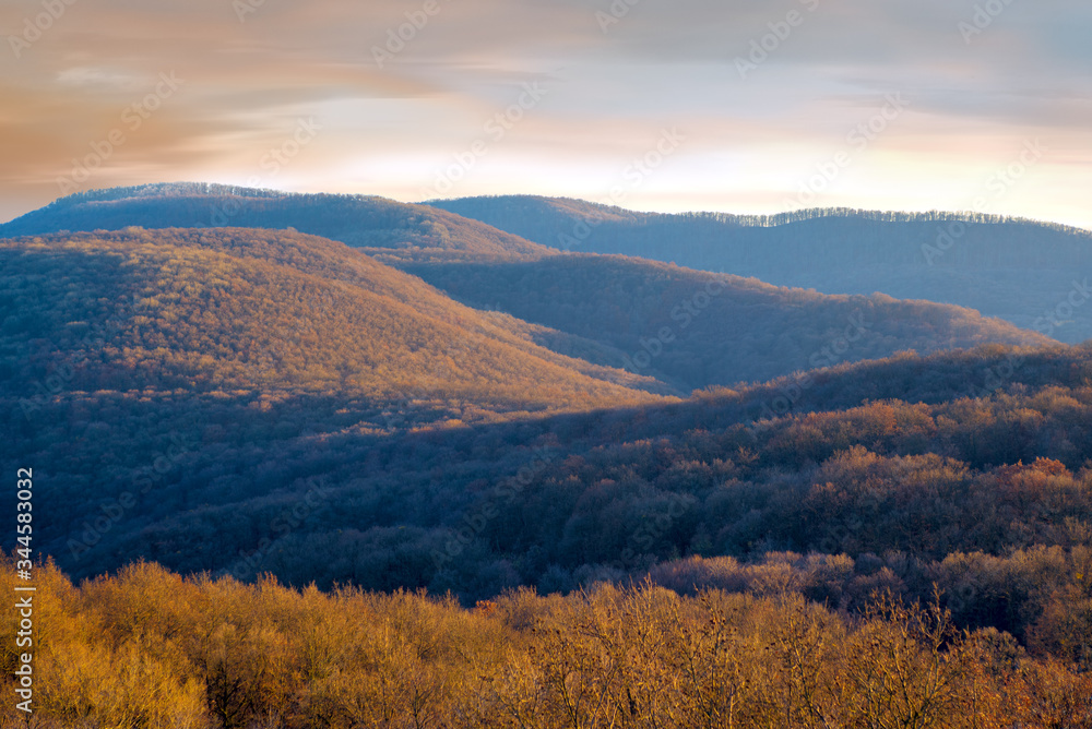 Fototapeta premium Autumn landscape in the mountains, forest covered hills