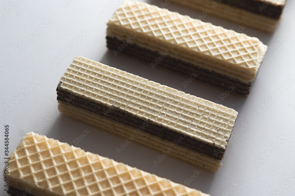 crispy waffle with cream and chocolate filling on a white background crispy waffle with cream and chocolate filling on a white background