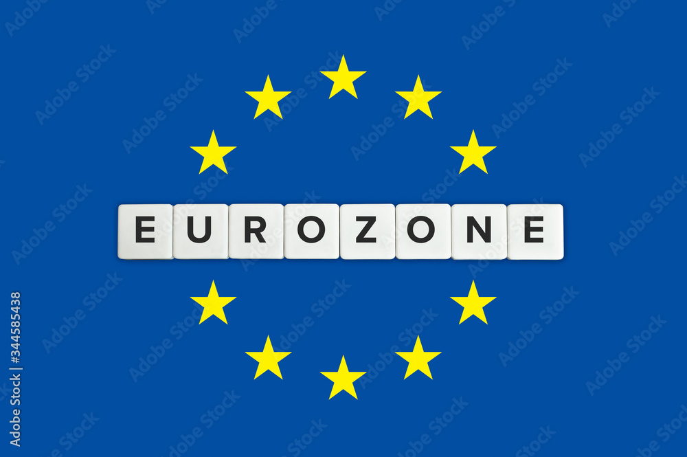 Eurozone or the euro area banner. Block letters and the European union (EU) flag in the background.