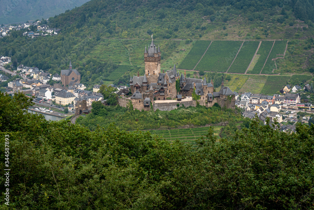 Castle Reichsburg sits above the medieval town of Cochem on the Mosel River, Germany.