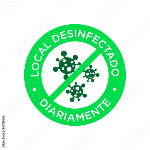 Daily disinfected premises icon written in Spanish. Coronavirus free round symbol.