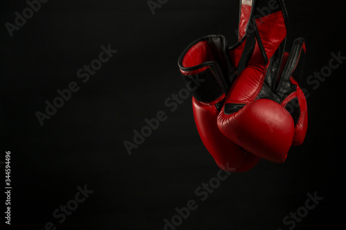 Boxing gloves with black background.