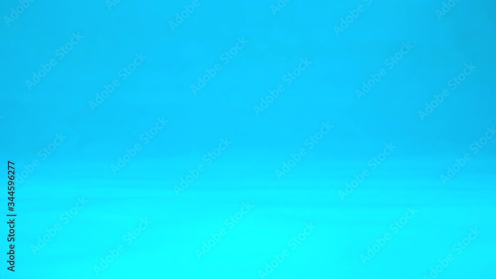 Avacado with eyes rolls slowly. Avacado with rolls on a blue background. Slow motion. Avacado with eyes rolls slowly. Avacado with rolls on a blue background. Slow motion.