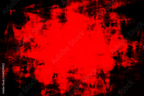 An abstract red grunge splattered blob background image.