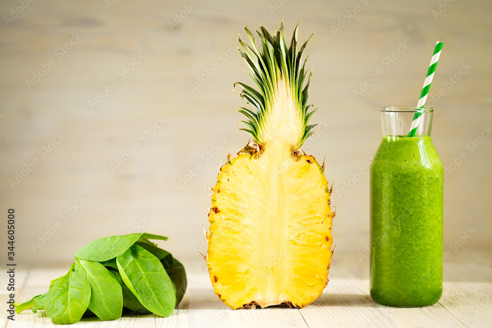 Healthy green smoothie with spinach, banana and pineapple. Raw, vegan, vegetarian, cooking food concept