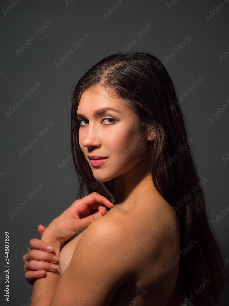 Fashion female portrait on grey background Fashion female portrait on grey background