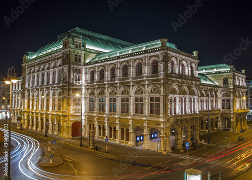 Night image of the Vienna Opera House with blurred traffic lights