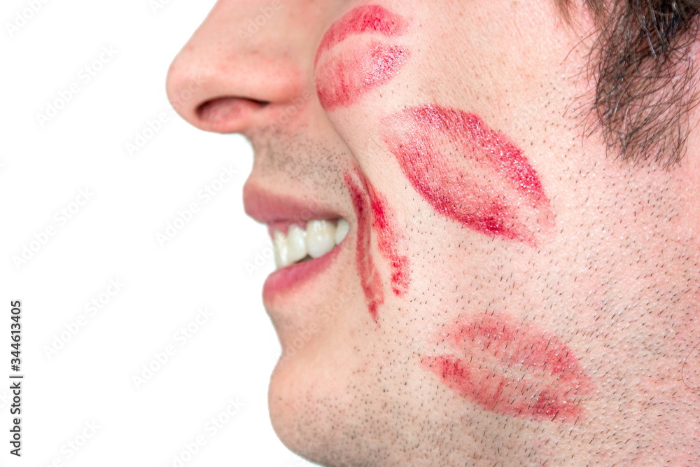 Foto Stock Caucasian white male man cheeks with red lipstick kiss marks  smiling no face isolated against white | Adobe Stock