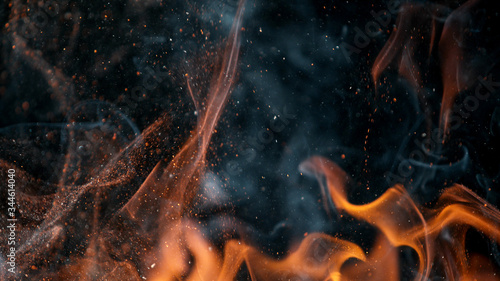 fire flames with sparks on a black background, close-up