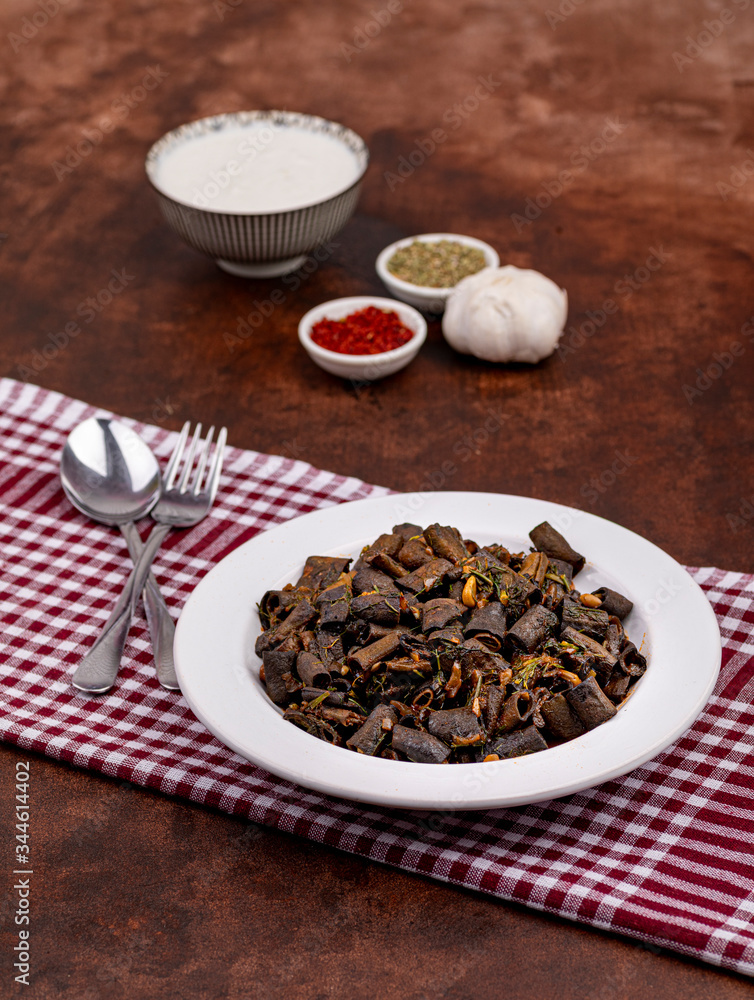 broad beans with traditional turkish food cooked together with spices on brown background broad beans with traditional turkish food cooked together with spices on brown background