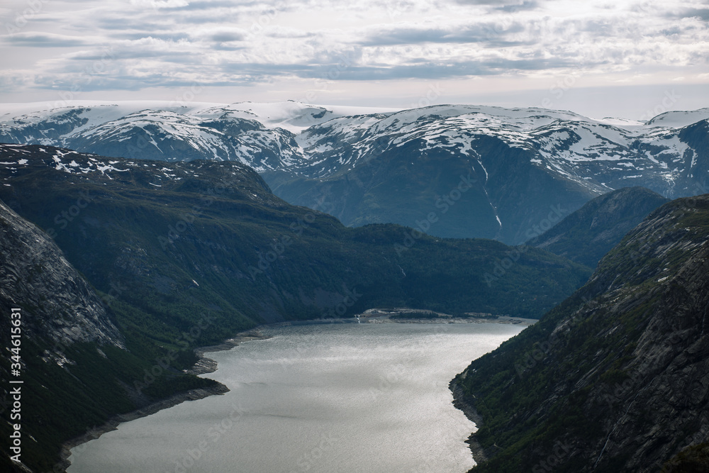 Norwegian landscape with a view of the fjord from a rock fragment Troll's tongue