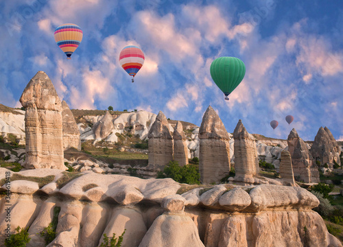 Colorful hot air balloons flying over Baglidere, or Love valley, Cappadocia, Anatolia, Turkey