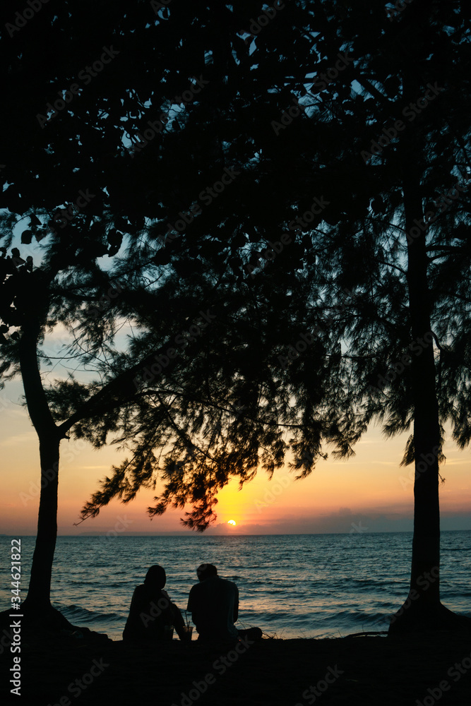 sunset view with silhuette of two people