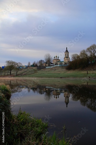 Landscape with church and river in early morning