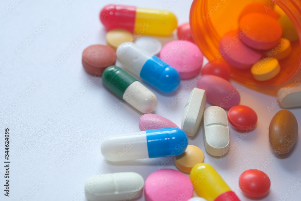 bottle of colorful pills white background bottle of colorful pills white background