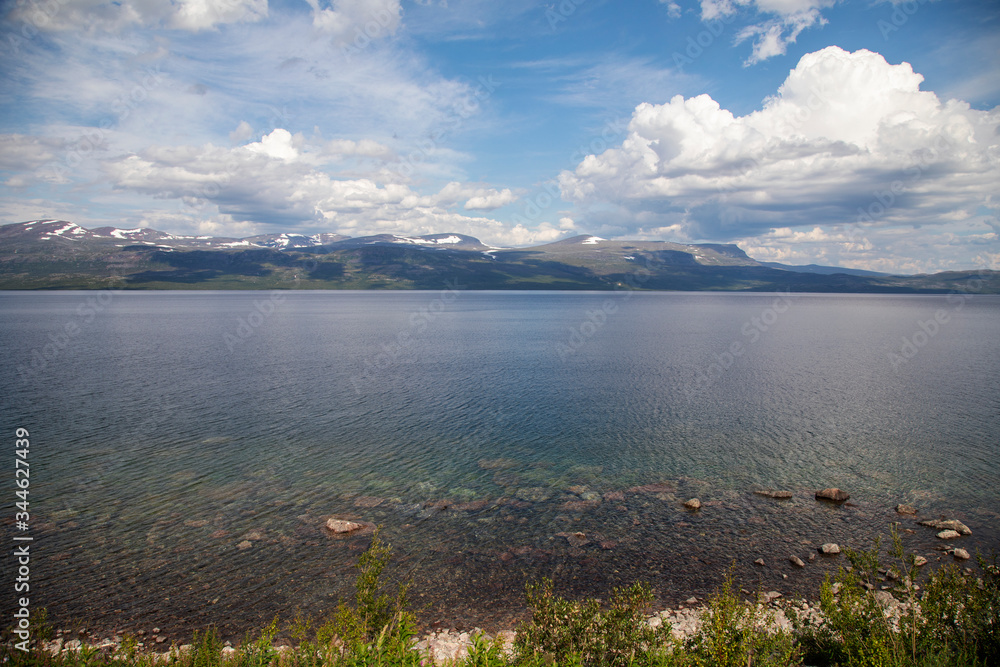 
Blue cloudy sky over swedish fjords and lake