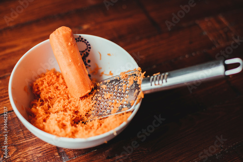 Grating Carrot in a bowl.