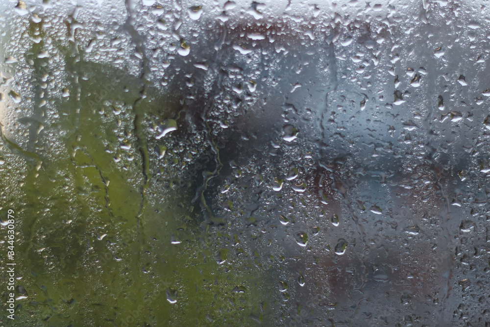 Rain drops on window glass surfaces Rain drops on window glass surfaces