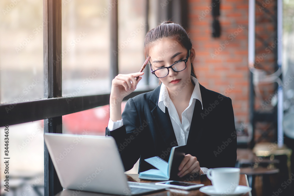 Businessman analyzing and recording information about financial business Businessman analyzing and recording information about financial business