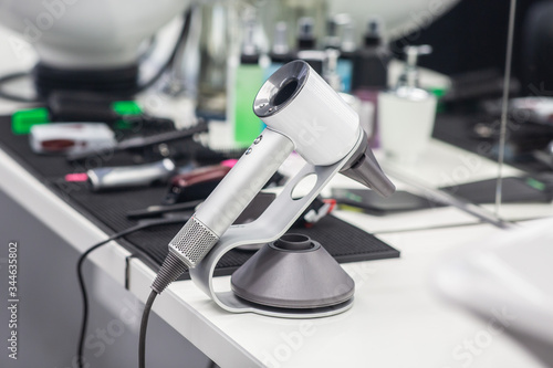 professional hairdryer on a white background table in barbershop