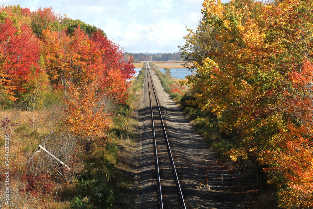 Train tracks in the fall with no one around Train tracks in the fall with no one around