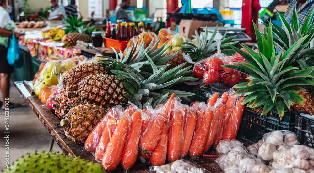 Colorful tropical fruits and vegetables in a famous food market in Sir Selwyn Selwyn Clarke Market at Mahe island, Seychelles