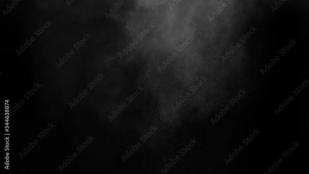 A dusty bullet hits a wall with flying debris. Powder explosion on a black background. Exposure to dust particles. Dust explosion on a black background, slow motion close-up. A dusty bullet hits a wall with flying debris. Powder explosion on a black background. Exposure to dust particles. Dust explosion on a black background, slow motion close-up.