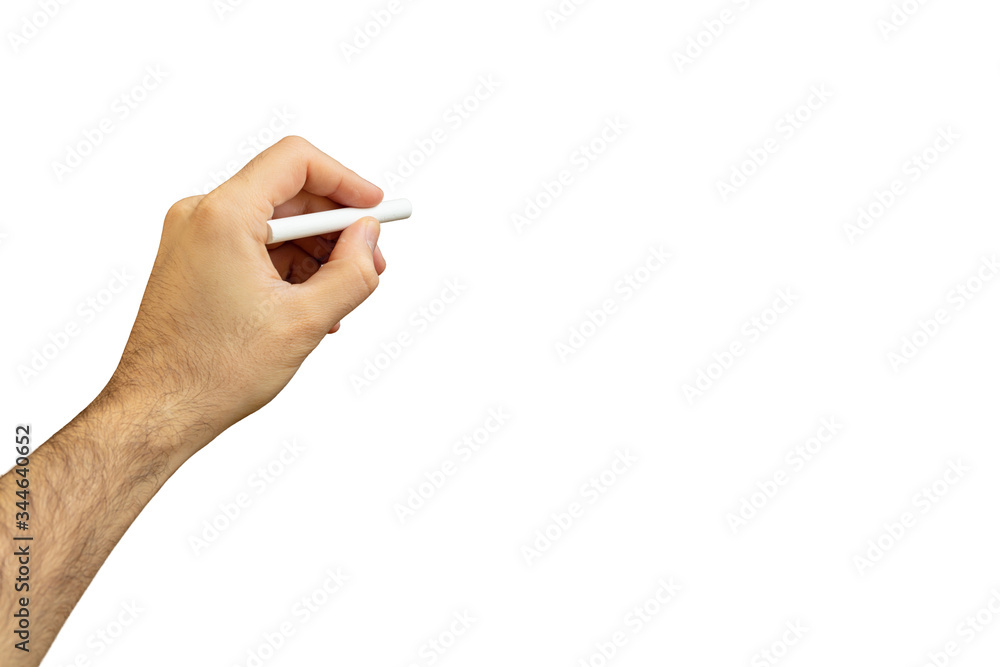 Left hand with a chalk isolated against whiteboard, copy space Left hand with a chalk isolated against whiteboard, copy space