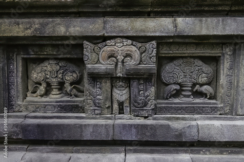 Sculped birds, lions and androforphic figures in the main pagoda of Prambanan Hindu Temple near Yogyakarta, Java island, Indonesia