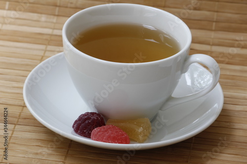 Fototapeta Naklejka Na Ścianę i Meble -  A Cup of tea and slices of marmalade on a saucer