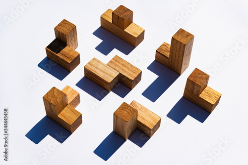 Generic wooden puzzle pieces on white