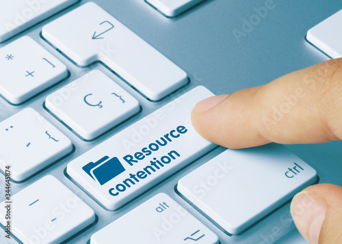 Resource contention - Inscription on Blue Keyboard Key. photo
