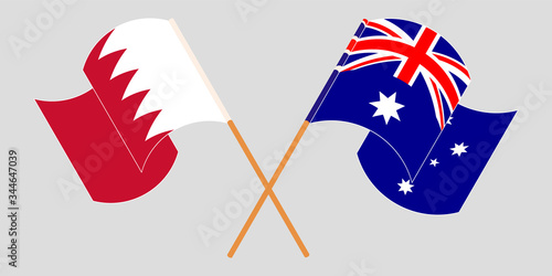 Crossed and waving flags of Bahrain and Australia