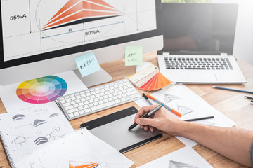 Graphic designer drawing sketches logo design.