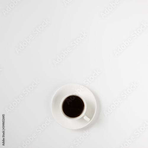 Coffee cup with espresso on abstract white background isolated