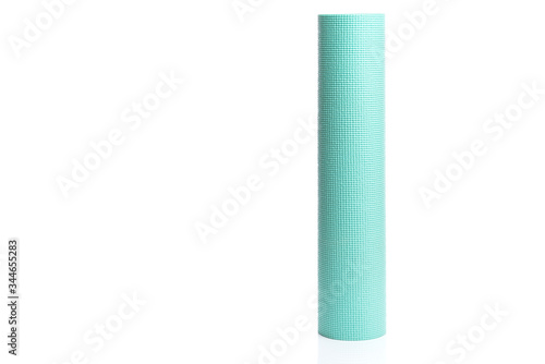 Rolled blue yoga or fitness mat isolated on white background