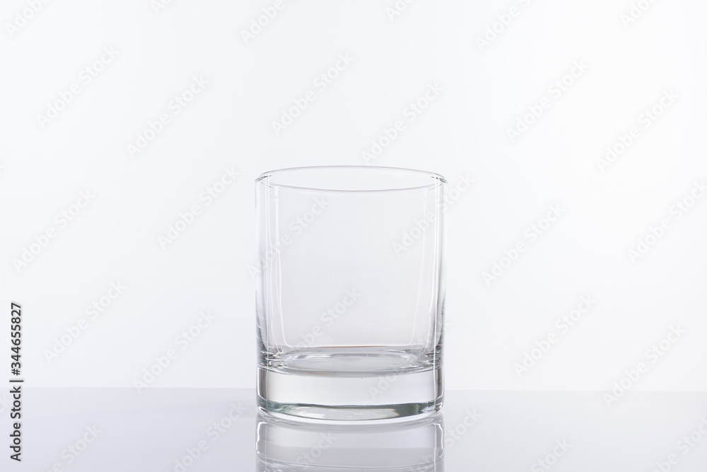 Empty glass cup isolated on white background. For alcohol or cocktails Empty glass cup isolated on white background. For alcohol or cocktails